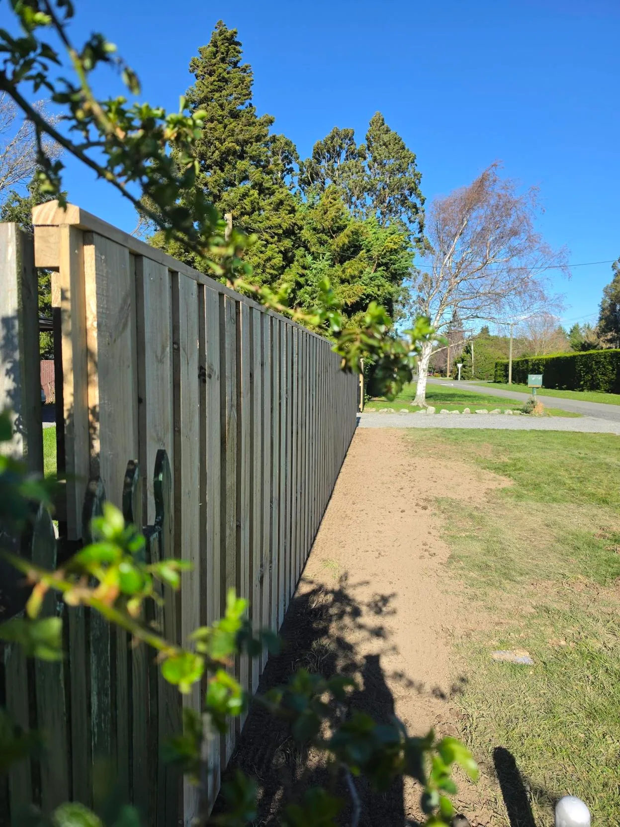 New timber paling fence with levelled soil strip prepared along the boundary at Waddington